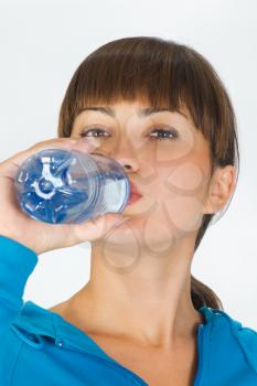 image of a young woman with bottle of water
