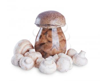 marinated mushrooms in the glass jar and fresh mushrooms isolated on white background