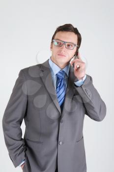 Young businessman with mobile phone wearing glasses