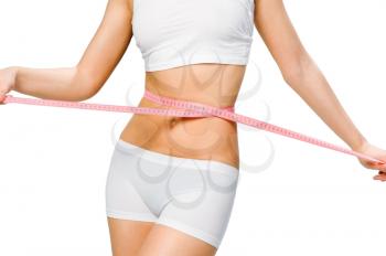 Girl showing how much weight she lost isolated on white