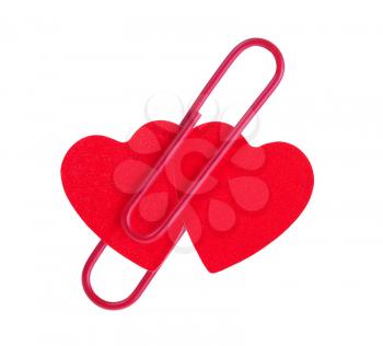 two red hearts pinned together isolated on white background