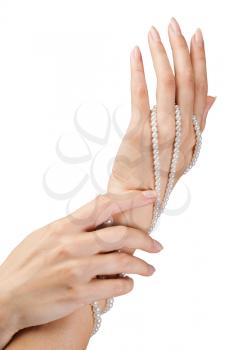 image of beautiful nails and woman fingers with pearls isolated on white