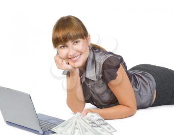 Successful businesswoman with dollars and  laptop isolated on white background