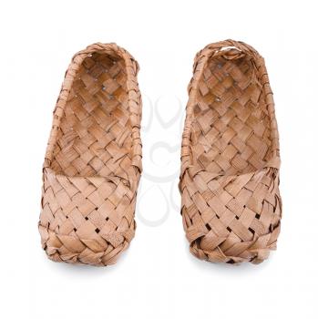 Old Russian bast shoes isolated on white background.Focus on the front.