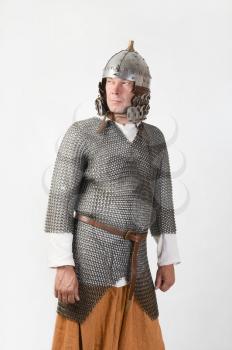 medieval warrior man wearing in ancient mail armor on white