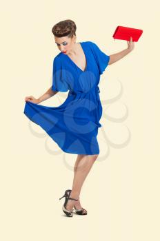 beautiful young woman in pinup style dressed isolated