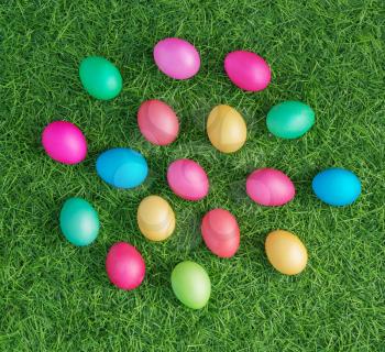 multicolored easter eggs on the green grass