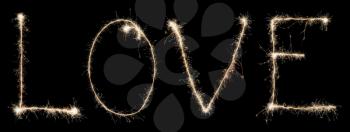 word love from sparkler isolated on black background