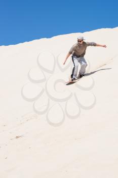 
Sandboarding at sand dunes in Little Sahara, Kangaroo Island, South Australia 