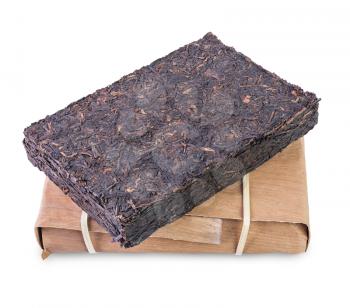 Aged chinese puer tea brick and pack of bamboo shoots isolated on white