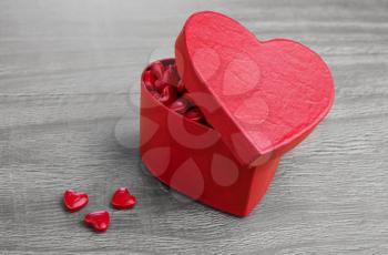 Heart shaped Valentines Day gift box on wooden background