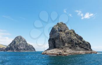 Majestic rocks in the famous Bay of Islands, New Zealand.Focus on the nearest rock