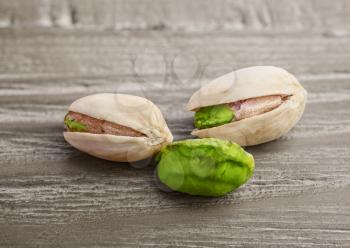 Pistachio nuts  on a vintage wooden background