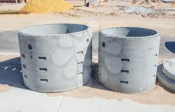 Two concrete soakwells on the construction site before installation