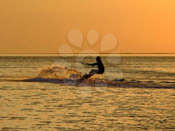 Royalty Free Photo of a Silhouetted Kitesurfer