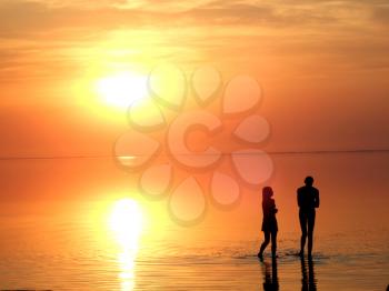 Royalty Free Photo of Silhouetted Children at Sunset on the Beach
