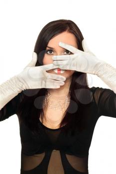 Royalty Free Photo of a Young Woman With Gloved Hands in Front of Her Face