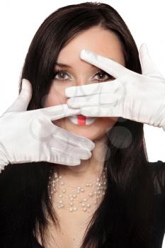 Royalty Free Photo of a Woman With Gloved Hands Over Her Face