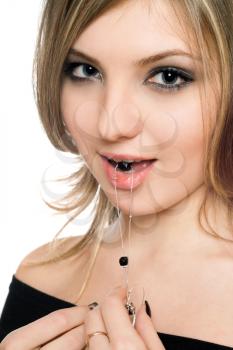 Royalty Free Photo of a Woman With a Bead in Her Mouth