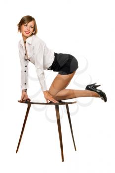 Royalty Free Photo of a Woman on a Table