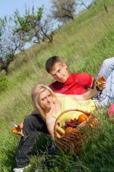 Royalty Free Photo of a Boy and Girl Having a Picnic