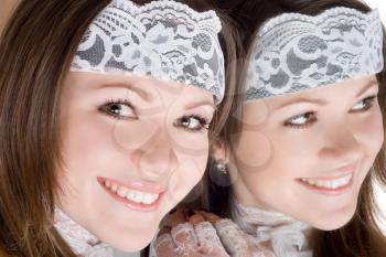 Royalty Free Photo of a Woman Wearing a Lace Headband and Gloves Reflected in a Mirror