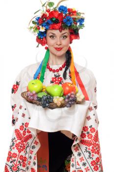 Royalty Free Photo of a Woman in a Traditional Costume With Fruit