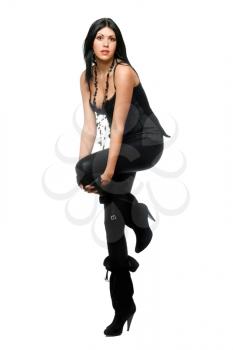 Royalty Free Photo of a Woman in Black Leggings and High Boots