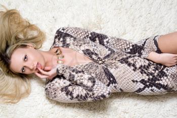 Royalty Free Photo of a Woman Lying on the Carpet