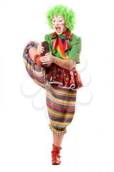 Royalty Free Photo of a Female Clown With Her Leg Up