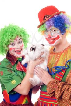 Royalty Free Photo of a Couple of Clowns With a Rabbit