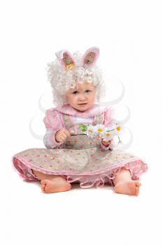 Royalty Free Photo of a Little Girl Wearing Bunny Ears Holding Flowers