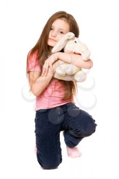 Royalty Free Photo of a Girl Hugging a Stuffed Animal