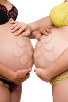 Royalty Free Photo of Two Pregnant Women's Bellies