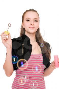 Royalty Free Photo of a Young Woman Blowing Bubbles