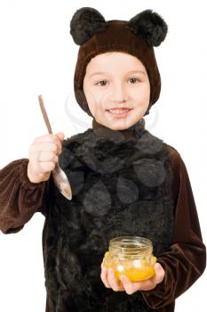 Royalty Free Photo of a Boy in a Bear Costume With a Jar of Honey