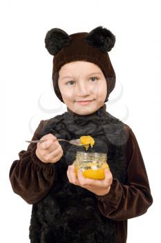 Royalty Free Photo of a Boy in a Bear Suit With a Jar of Honey