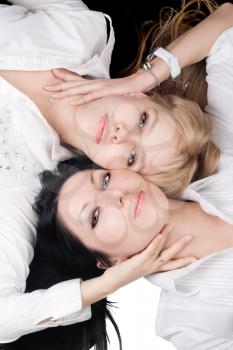 Royalty Free Photo of Two Women Lying Down