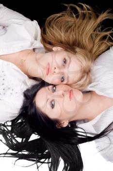 Royalty Free Photo of Two Women Lying Head to Head