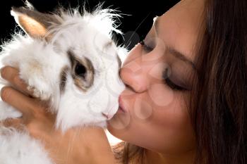 Royalty Free Photo of a Woman Kissing a Rabbit