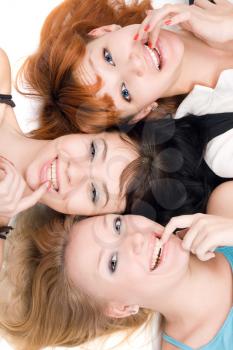 Royalty Free Photo of Three Women With Their Finger in Their Mouth