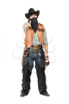 Royalty Free Photo of a Cowboy Wearing a Scarf Over His Face and Pointing a Gun
