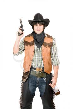 Royalty Free Photo of a Cowboy With a Bottle and Gun