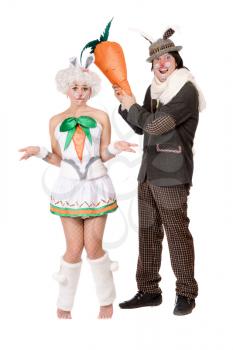 Royalty Free Photo of a Man and Woman in Bunny Costumes With a Big Carrot