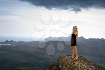 Royalty Free Photo of a Woman on a Cliff