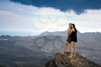 Royalty Free Photo of Two Women on a Cliff
