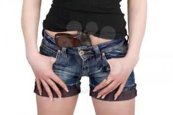 Royalty Free Photo of a Woman With a Pistol Tucked Into Her Shorts