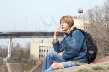 Royalty Free Photo of a Guy Outside With a Cigarette