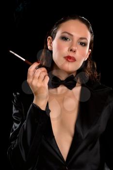 Royalty Free Photo of a Woman With a Cigarette Holder