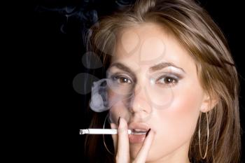 Royalty Free Photo of a Woman Smoking